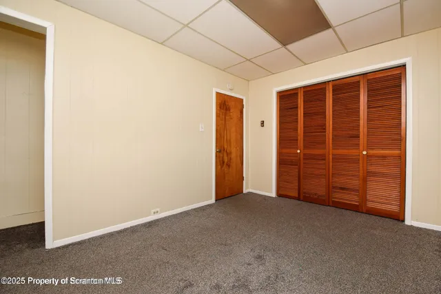 a view of an empty room with a garage