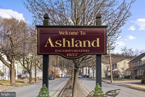 a sign board with buildings