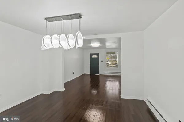 wooden floor in a hall with an entryway