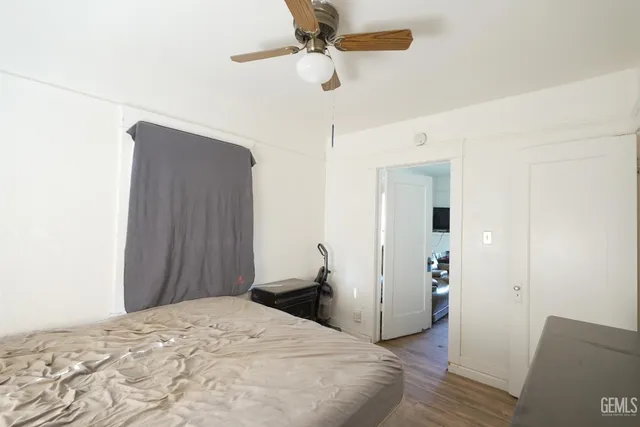 a bathroom with a sink a toilet and shower curtain