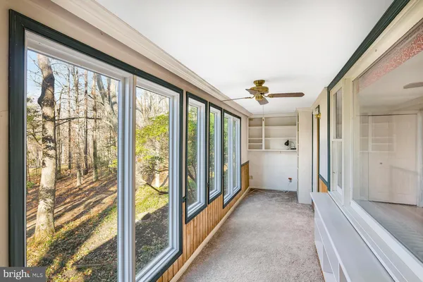 a view of a hallway with windows