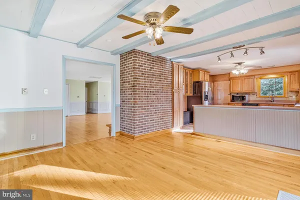 a view of a livingroom with a kitchen