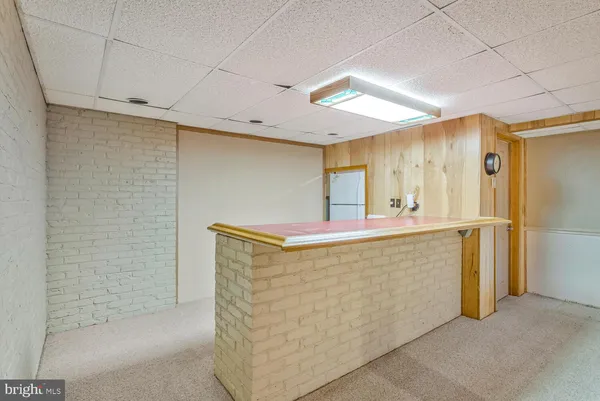 a kitchen with a refrigerator and a refrigerator