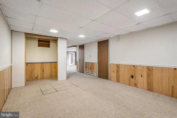 a view of an empty room with a cabinet