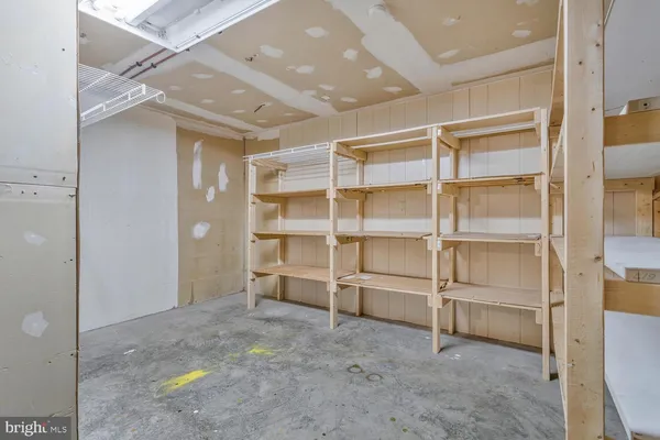 a view of an empty room with a fireplace
