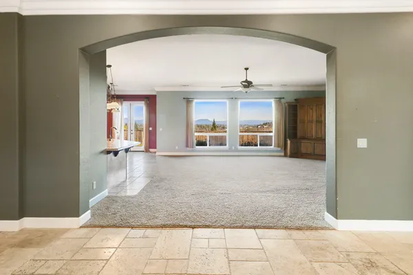 a kitchen with kitchen island granite countertop a sink and stove