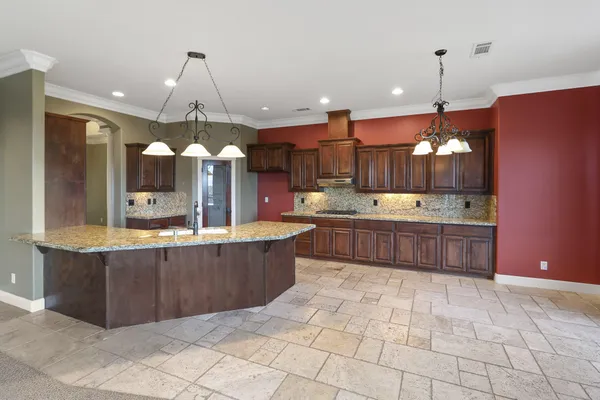 a kitchen with wooden cabinets and a sink