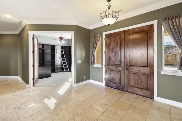 a view of an empty room with a window