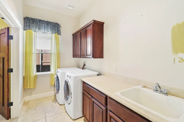 a view of a hallway with a washer and dryer