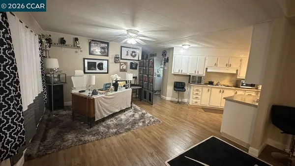 a dining room with wooden floor and a table