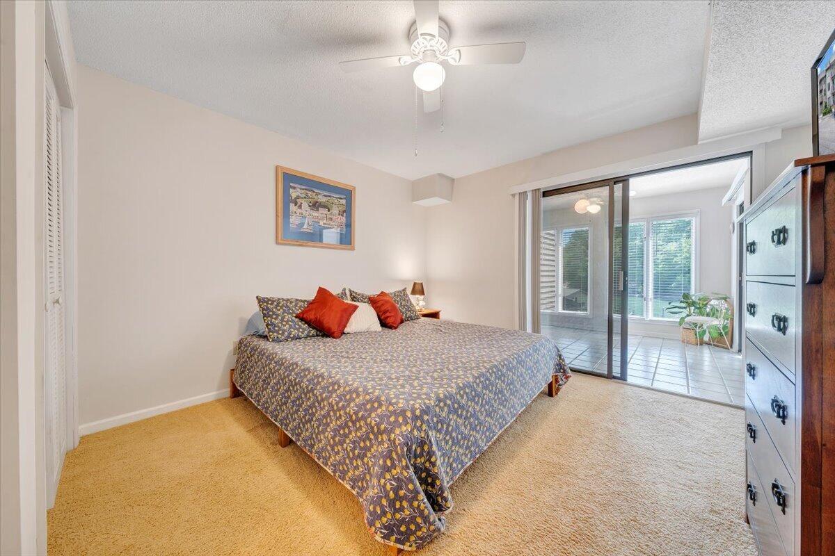 620 Monte Vista Road, Unit 602 Union Hall, VA 24176 - Photo 16 of 48 a bedroom with a bed and a chandelier