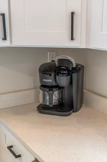 a kitchen with a sink stove and refrigerator