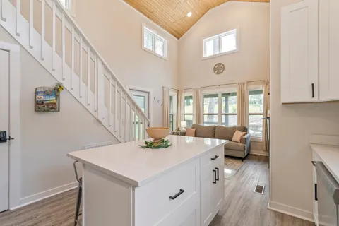 a view of entryway and hall with a front door