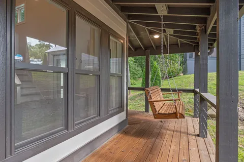a view of two chairs in the balcony