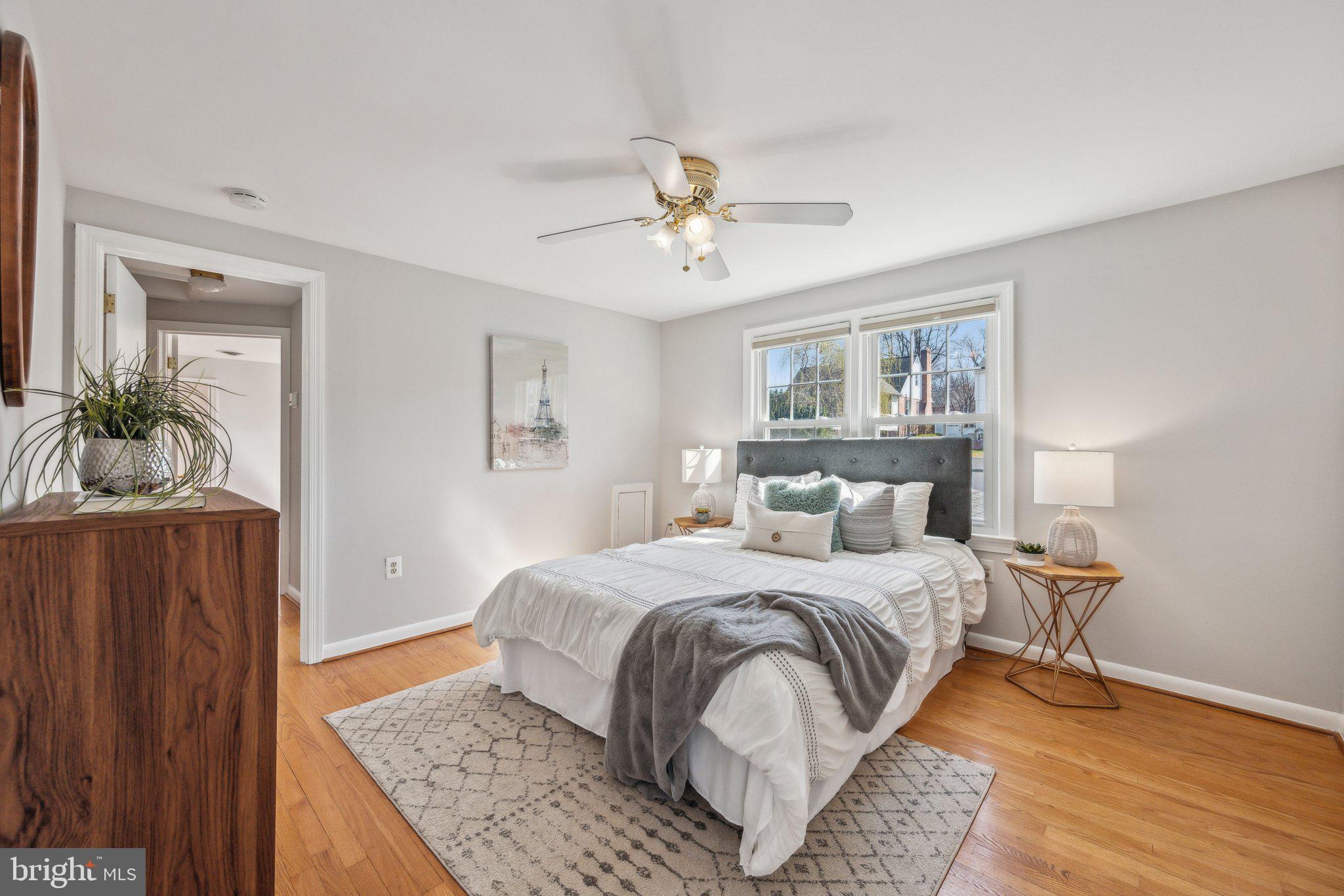 1720 Dublin Drive Silver Spring, MD 20902 - Photo 18 of 34 a bedroom with a bed and wooden floor