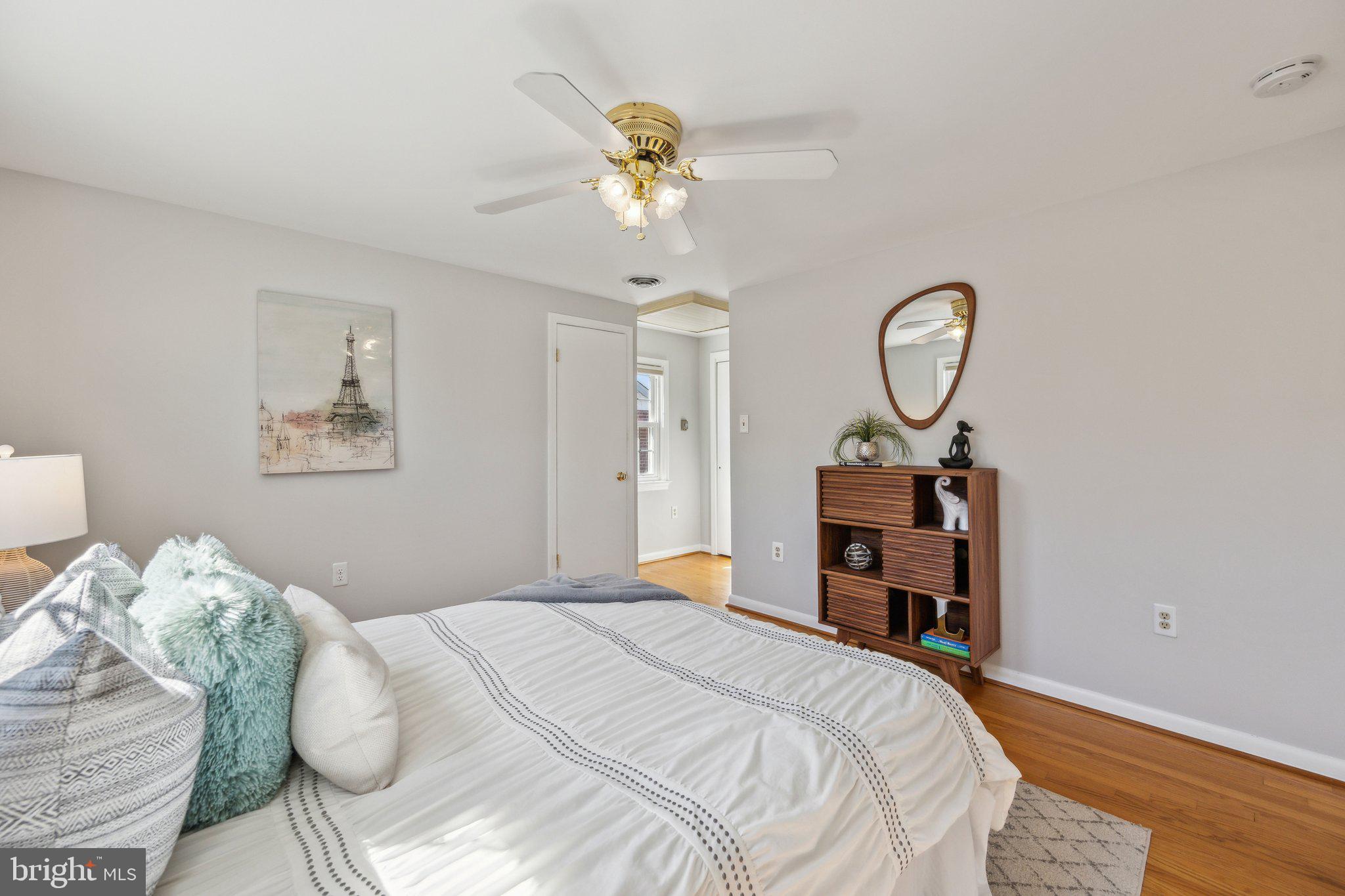 1720 Dublin Drive Silver Spring, MD 20902 - Photo 19 of 34 a bedroom with a bed and a chandelier
