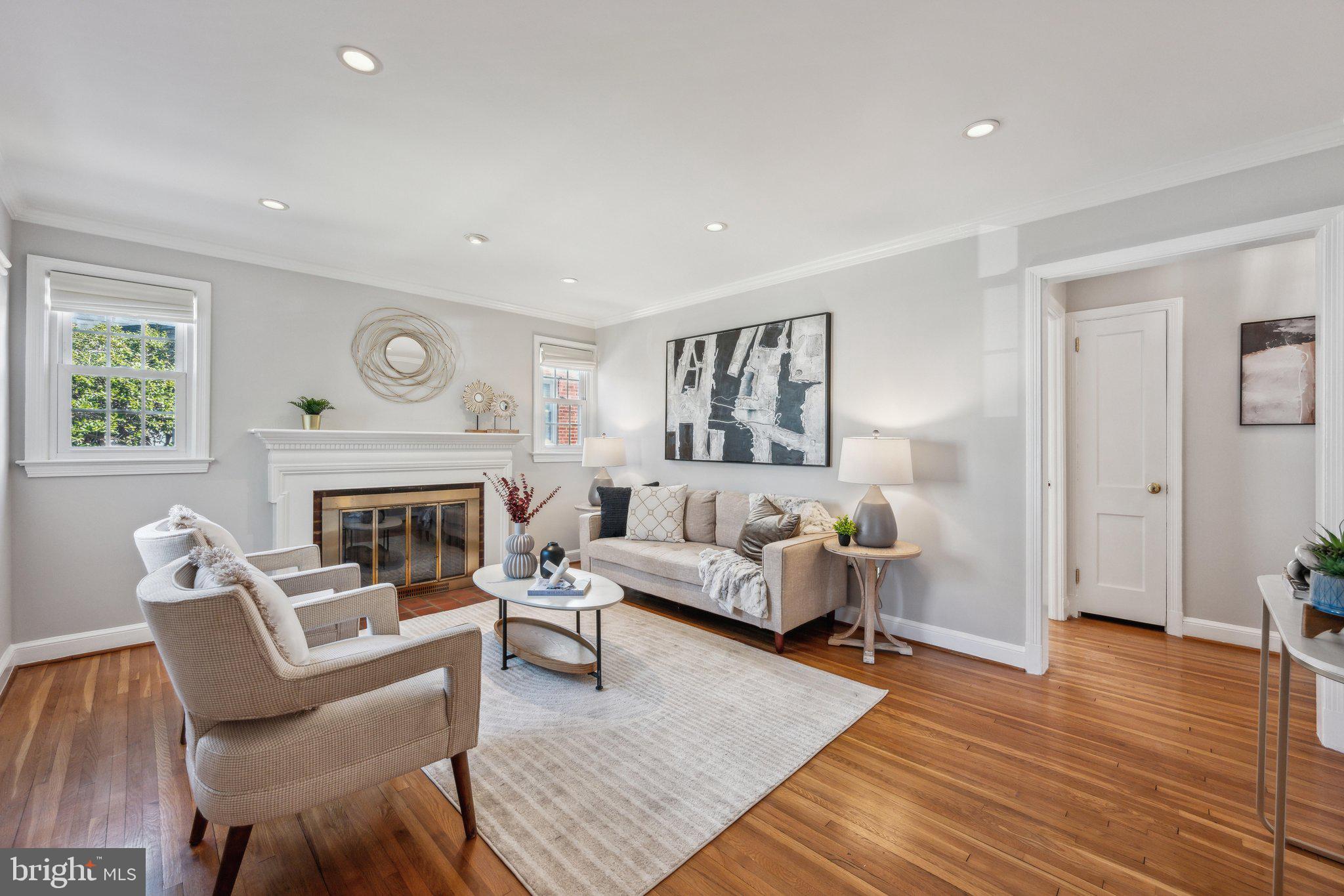 1720 Dublin Drive Silver Spring, MD 20902 - Photo 2 of 34 a living room with furniture and a fireplace