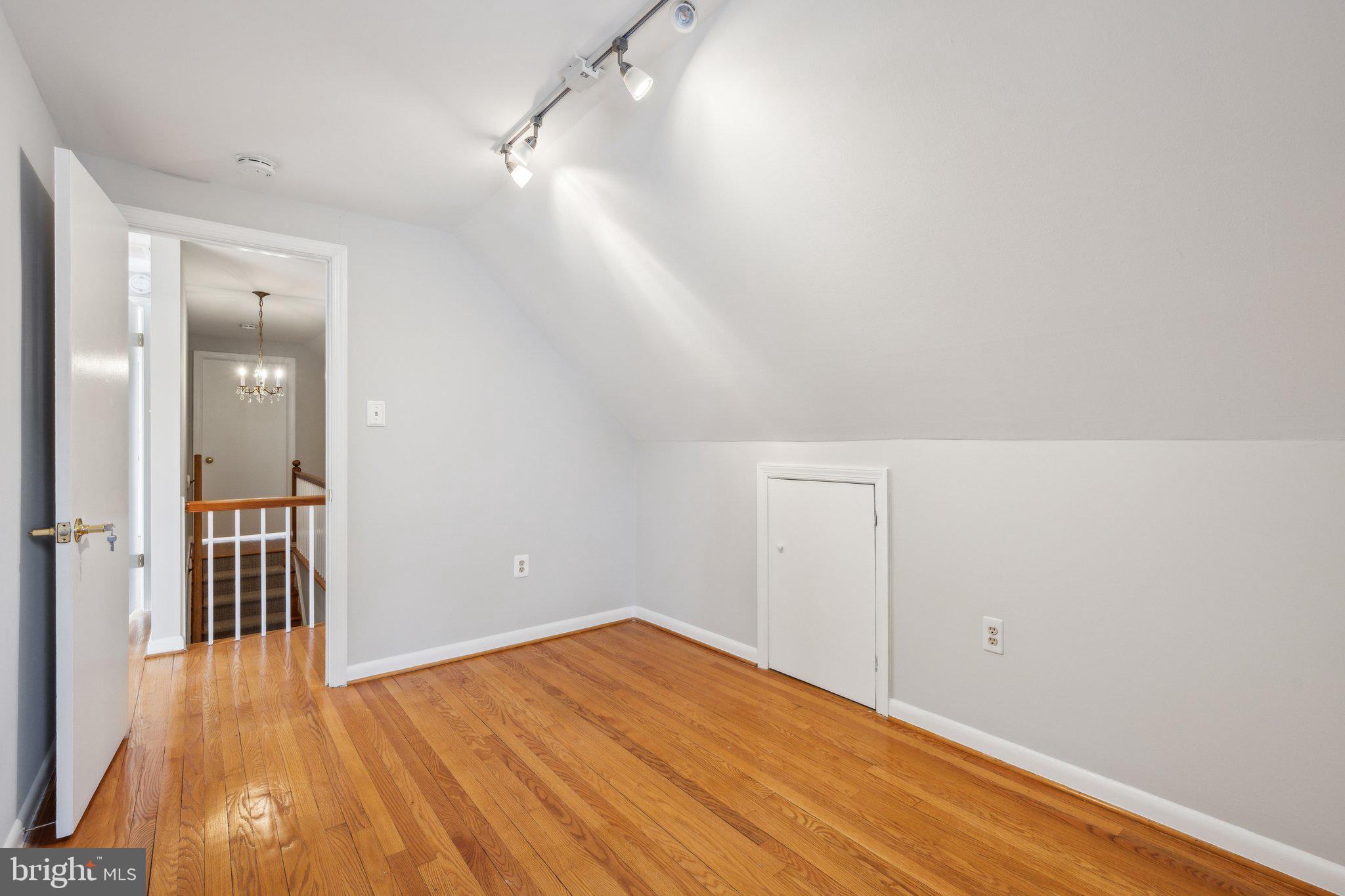 1720 Dublin Drive Silver Spring, MD 20902 - Photo 21 of 34 a view of a room with wooden floor and a ceiling fan