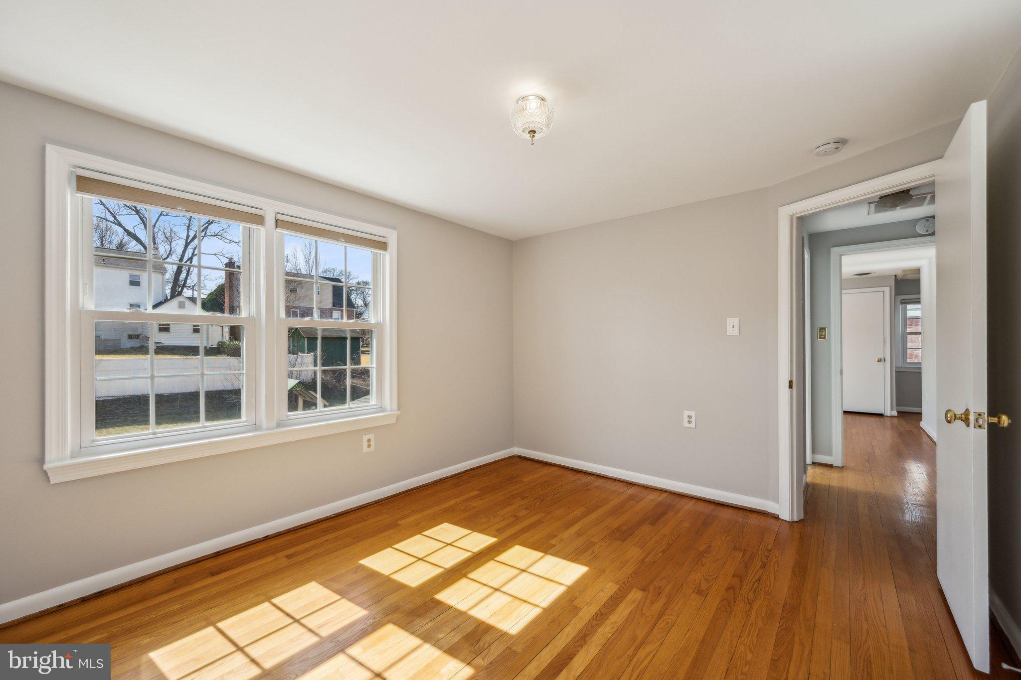 1720 Dublin Drive Silver Spring, MD 20902 - Photo 23 of 34 a view of empty room with wooden floor and fan