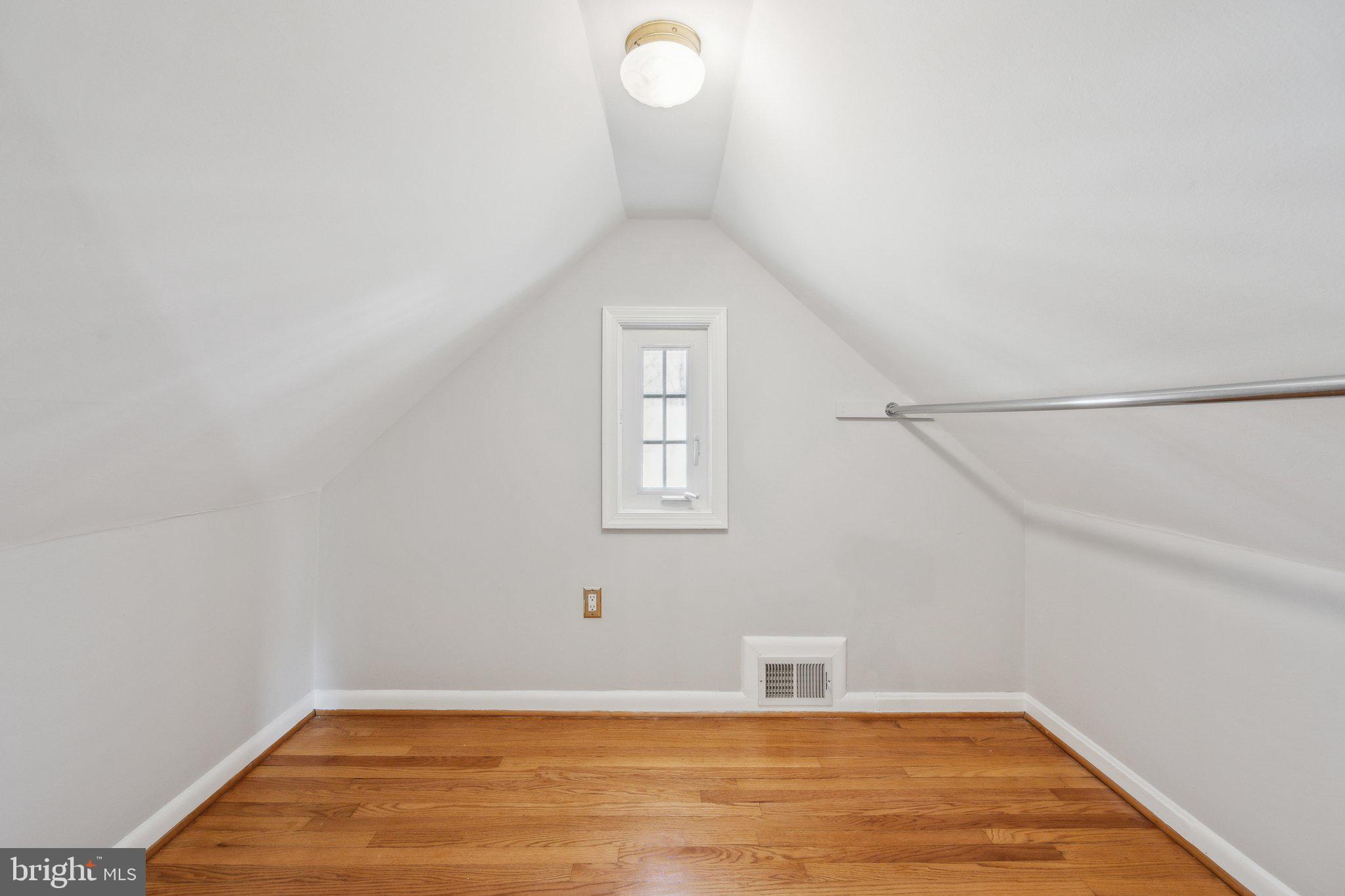 1720 Dublin Drive Silver Spring, MD 20902 - Photo 24 of 34 a view of a room with wooden floor and white walls