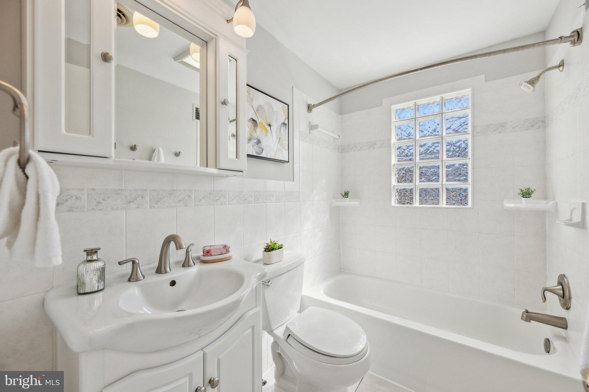 1720 Dublin Drive Silver Spring, MD 20902 - Photo 25 of 34 a bathroom with a sink a toilet and a bathtub