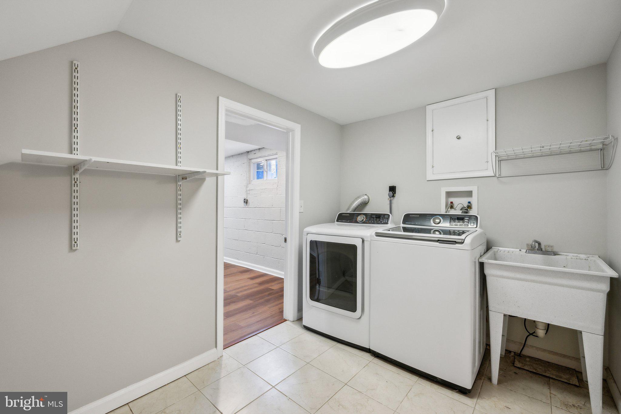 1720 Dublin Drive Silver Spring, MD 20902 - Photo 31 of 34 a utility room with dryer and washer