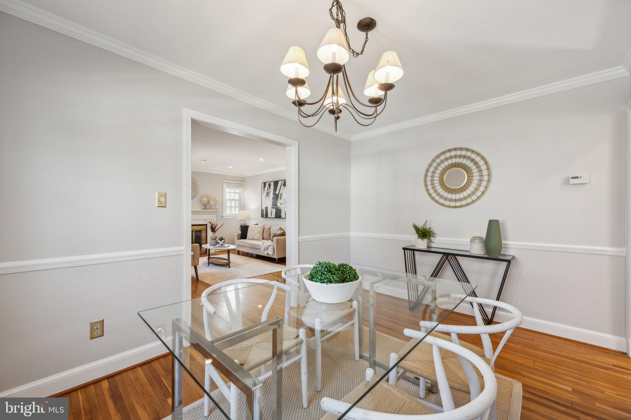 1720 Dublin Drive Silver Spring, MD 20902 - Photo 6 of 34 a view of a dining room with furniture a chandelier and wooden floor