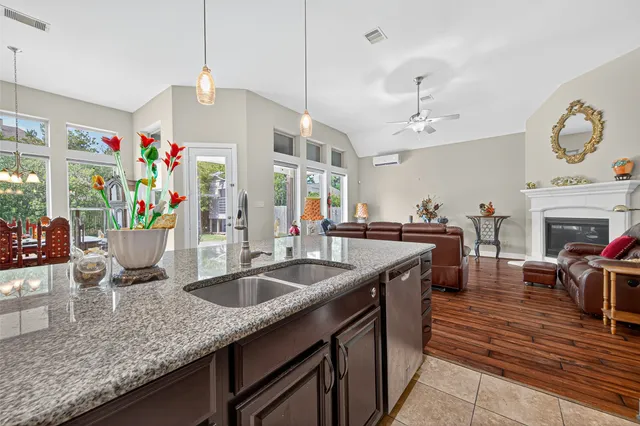 a kitchen with stainless steel appliances granite countertop a sink and stove