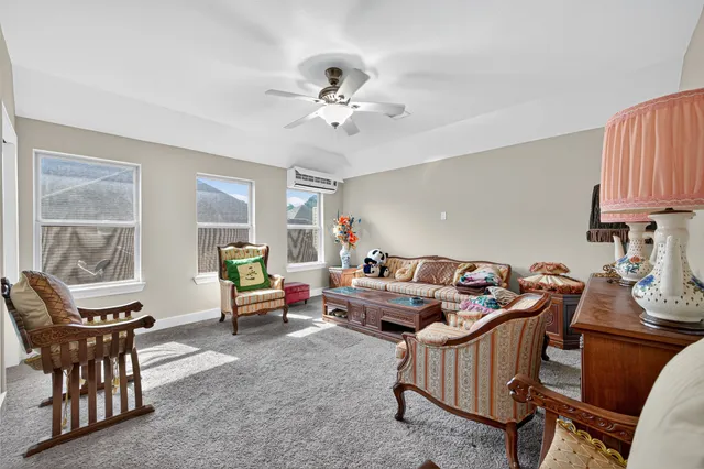 a view of a hallway with wooden floor and entryway