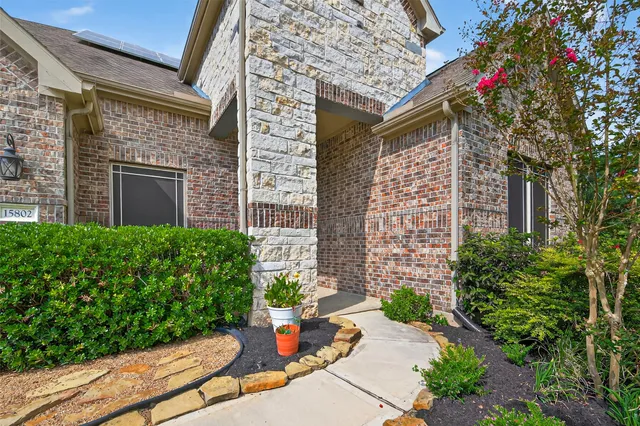 a front view of a house with an outdoor seating