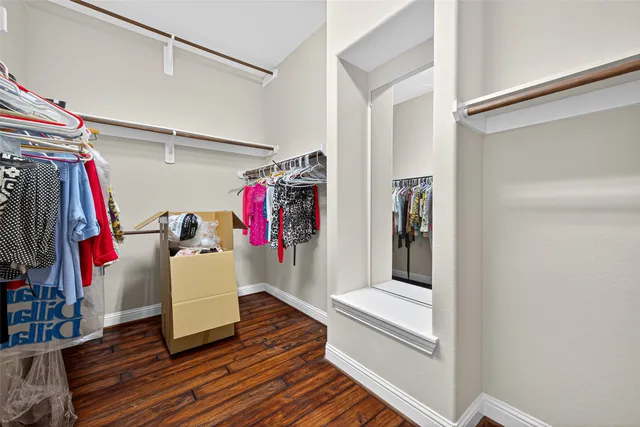 a large bathroom with a sink a mirror and a bathtub