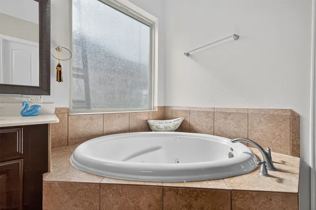 a view of house with yard and outdoor seating