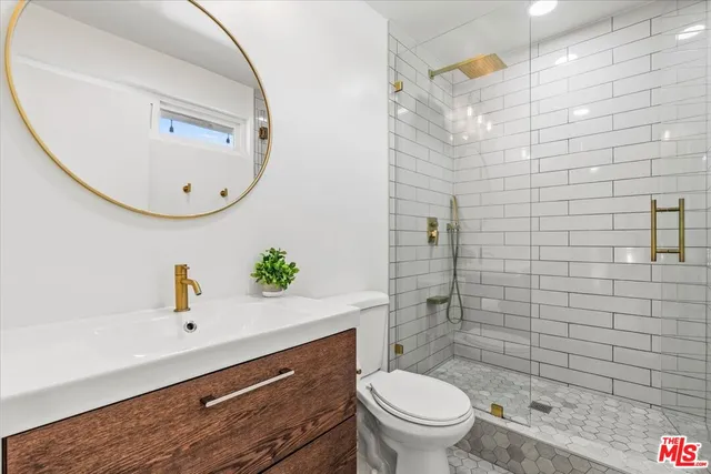 a view of a bedroom with furniture and a window