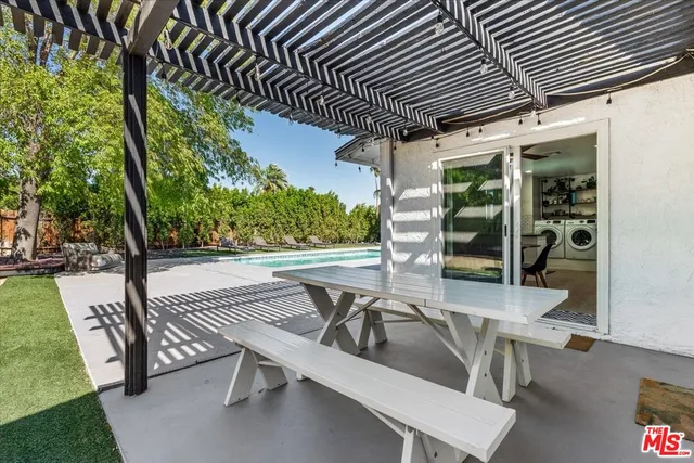 a view of swimming pool with a patio