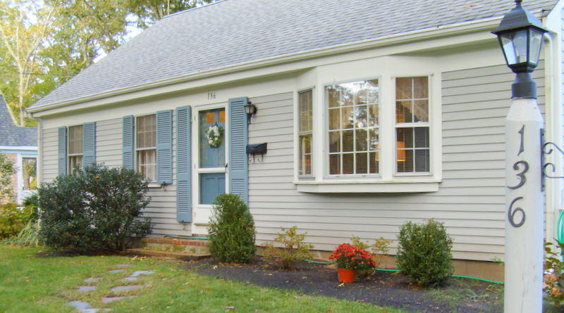 136 Scudder Road Osterville, MA 02655 - Photo 2 of 14 a front view of a house with a yard