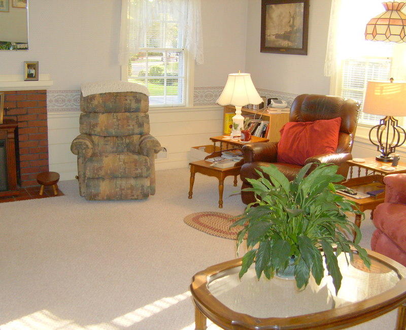 136 Scudder Road Osterville, MA 02655 - Photo 4 of 14 a living room with furniture and a lamp