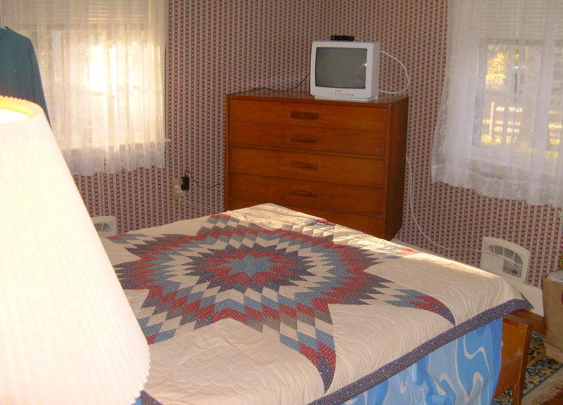 136 Scudder Road Osterville, MA 02655 - Photo 10 of 14 a bedroom with a bed and a window