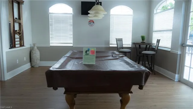 a living room with furniture and windows