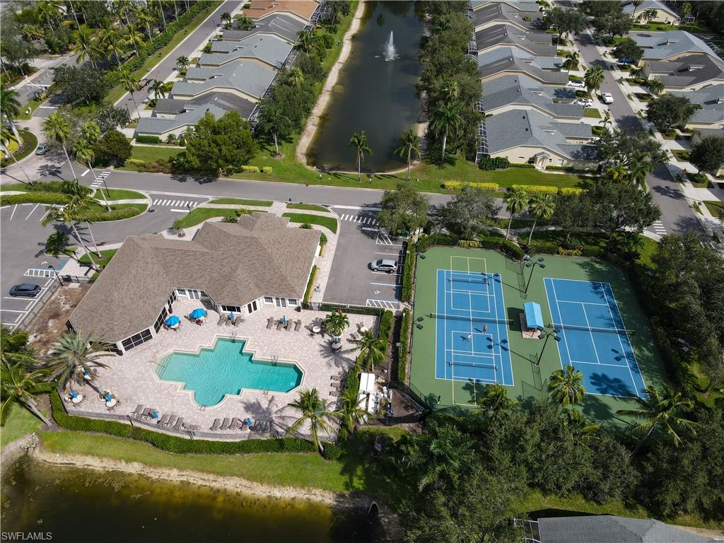 8220 Ibis Cove Circle, Unit B216 Naples, FL 34119 - Photo 27 of 34 an aerial view of a house with a swimming pool and outdoor space