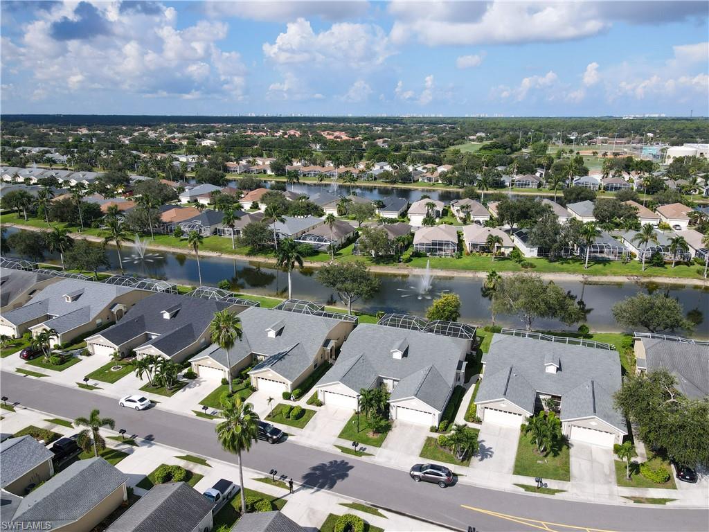 8220 Ibis Cove Circle, Unit B216 Naples, FL 34119 - Photo 29 of 34 an aerial view of a city with lots of residential buildings
