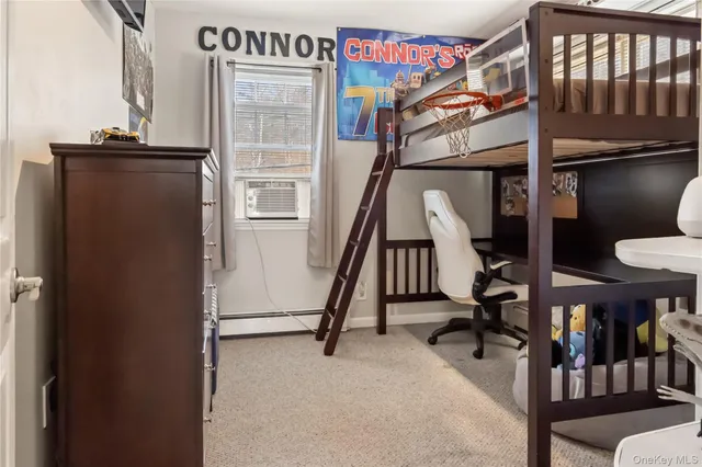 a view of a livingroom with furniture and stairs