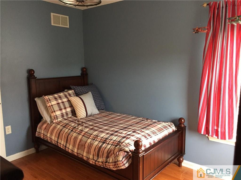 20 Carnation Road Monroe Township, NJ 08831 - Photo 12 of 23 a bedroom with a bed and window