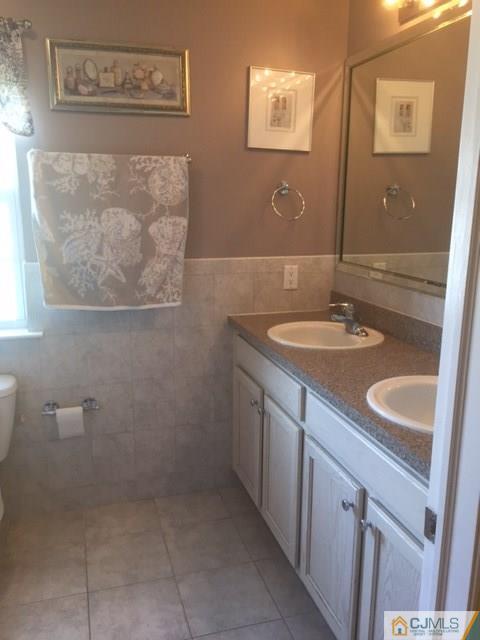 20 Carnation Road Monroe Township, NJ 08831 - Photo 14 of 23 a bathroom with a sink and a mirror