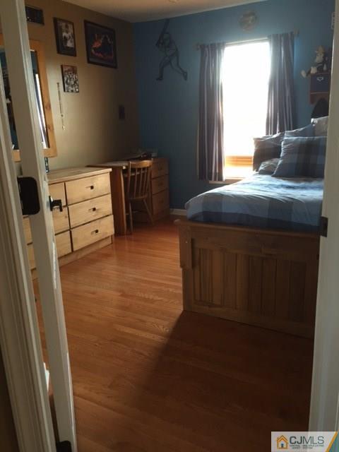 20 Carnation Road Monroe Township, NJ 08831 - Photo 17 of 23 a kitchen with a wooden floor and a window