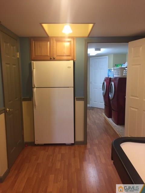20 Carnation Road Monroe Township, NJ 08831 - Photo 21 of 23 a view of washer and dryer with wooden floor
