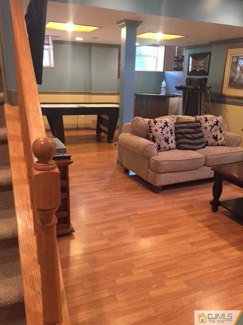 20 Carnation Road Monroe Township, NJ 08831 - Photo 23 of 23 a living room with furniture and a fireplace