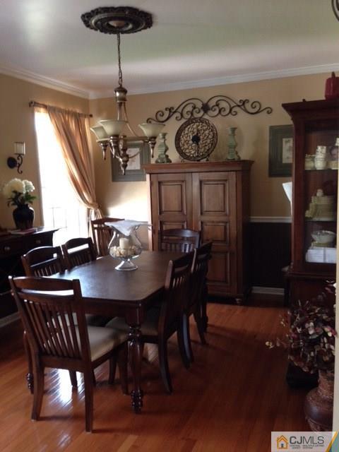 20 Carnation Road Monroe Township, NJ 08831 - Photo 4 of 23 a view of a dining room with furniture and chandelier