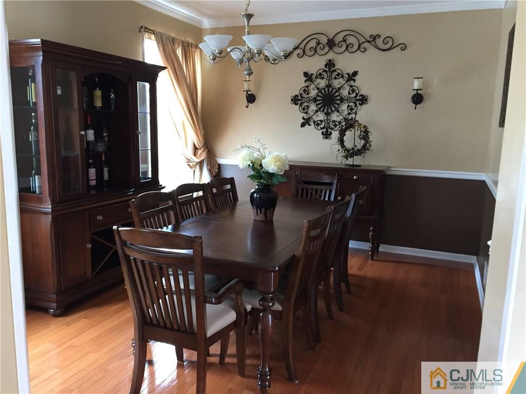 20 Carnation Road Monroe Township, NJ 08831 - Photo 5 of 23 a view of a dining room with furniture and chandelier