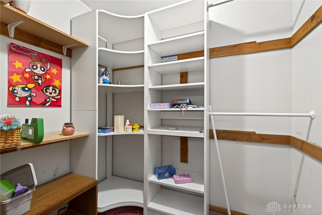 2470 Clark Run Road Xenia, OH 45385 - Photo 30 of 57 This organized walk-in closet offers ample storage and shelving for a streamlined living space.
