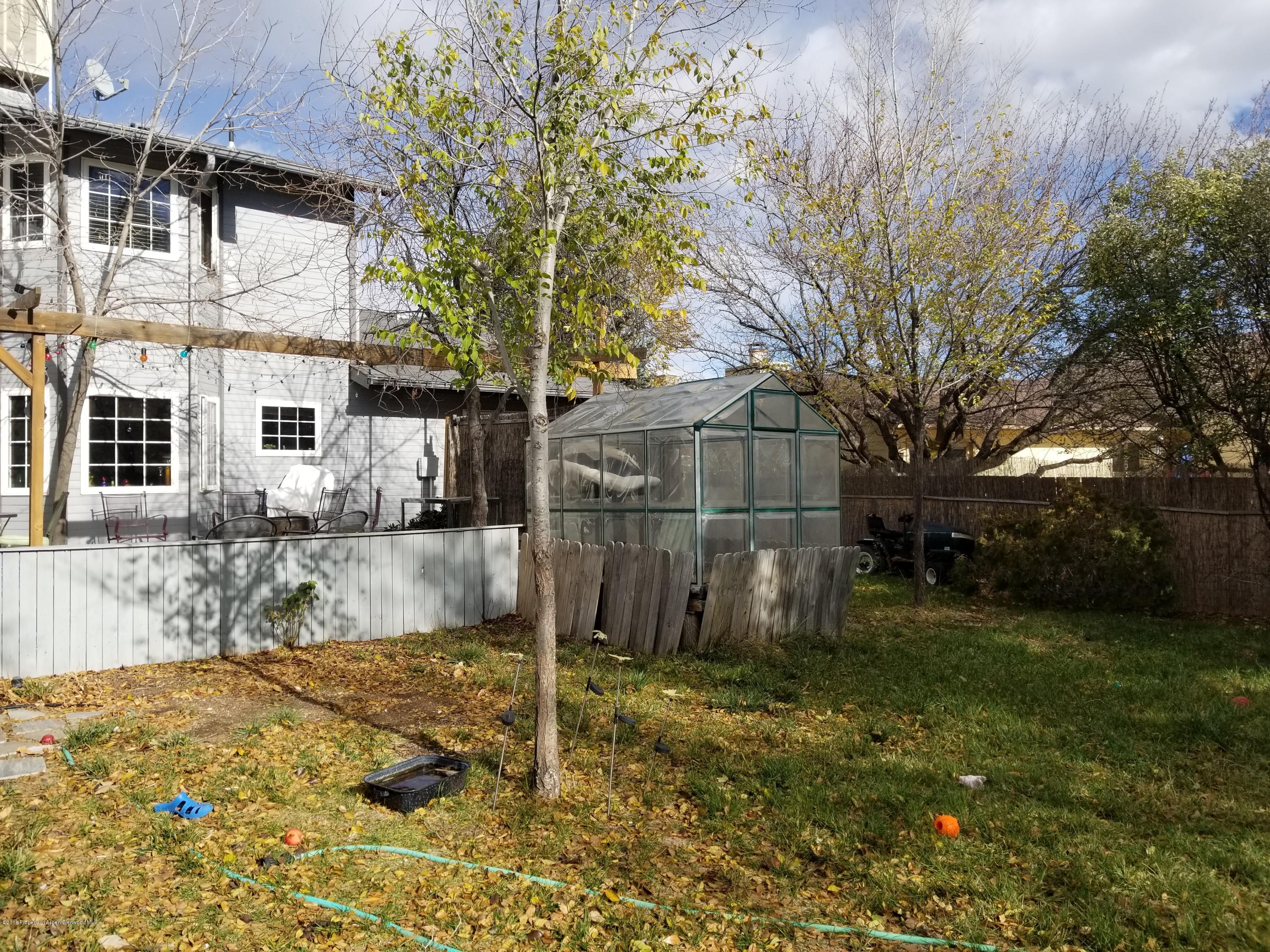917 Edelweiss Court Rifle, CO 81650 - Photo 29 of 31 a view of a yard with a large tree